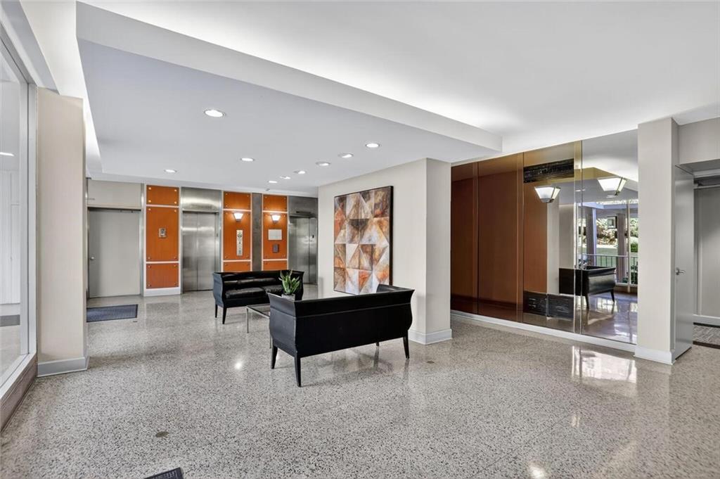 130 26th Street Northwest, Unit 804 Atlanta, GA 30309 - Photo 4 of 25 a living room with furniture and a table