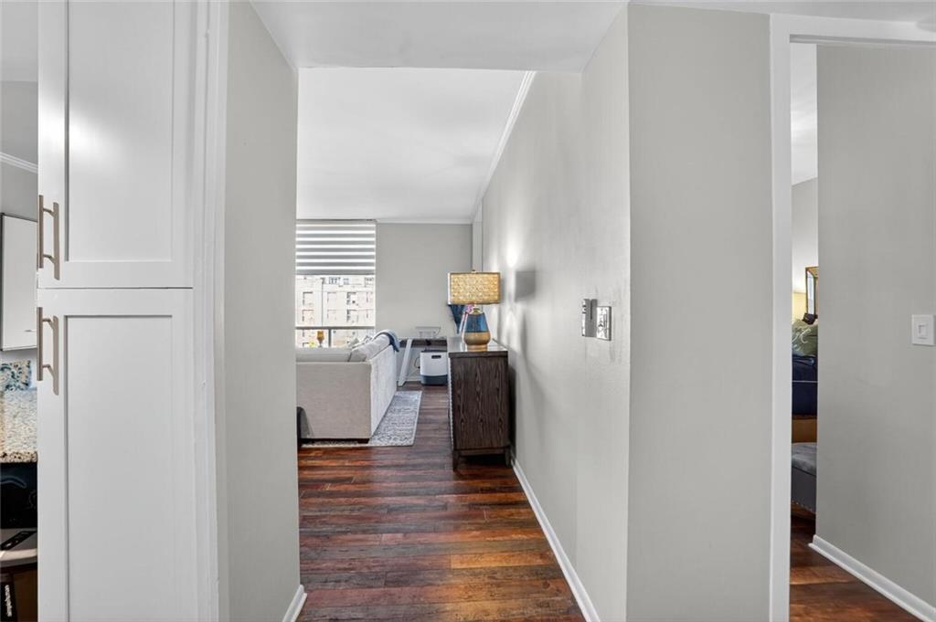 130 26th Street Northwest, Unit 804 Atlanta, GA 30309 - Photo 5 of 25 a view of a hallway with wooden floor and staircase