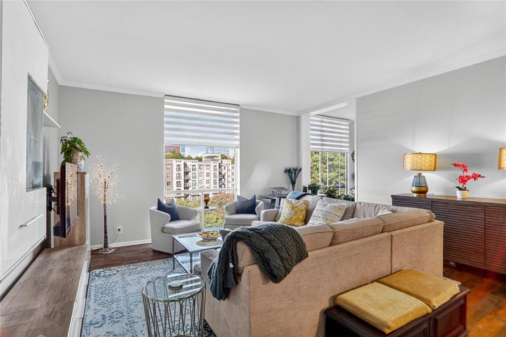 130 26th Street Northwest, Unit 804 Atlanta, GA 30309 - Photo 9 of 25 a living room with furniture and a window