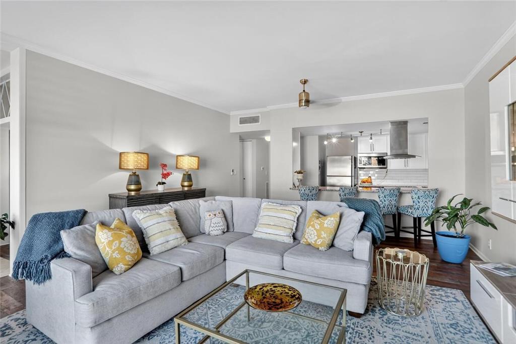 130 26th Street Northwest, Unit 804 Atlanta, GA 30309 - Photo 10 of 25 a living room with furniture and kitchen view