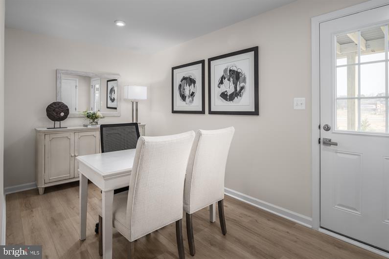 23 Debra Lane, Unit 53B Carlisle, PA 17013 - Photo 18 of 19 a view of a dining room with furniture and wooden floor