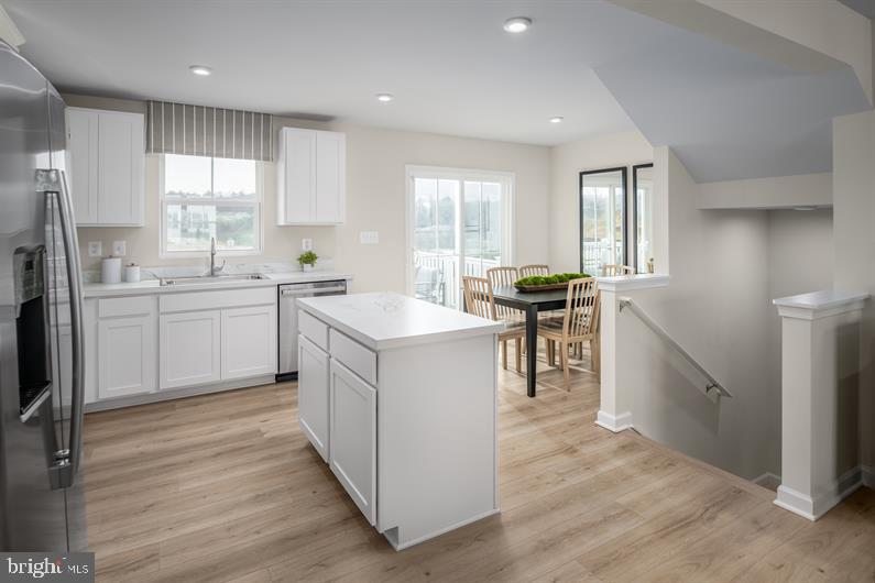 23 Debra Lane, Unit 53B Carlisle, PA 17013 - Photo 6 of 19 a kitchen with a sink stove and cabinets
