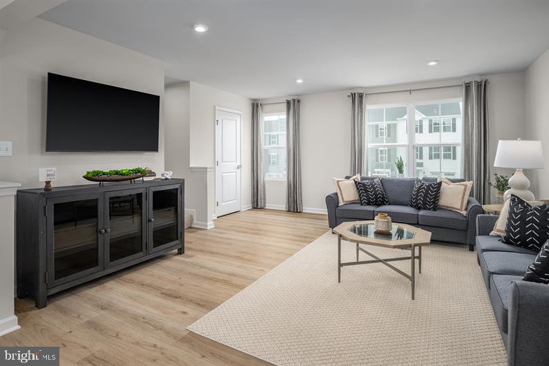 23 Debra Lane, Unit 53B Carlisle, PA 17013 - Photo 8 of 19 a living room with furniture and a flat screen tv