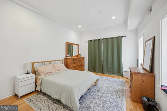 a bedroom with a bed and a couch