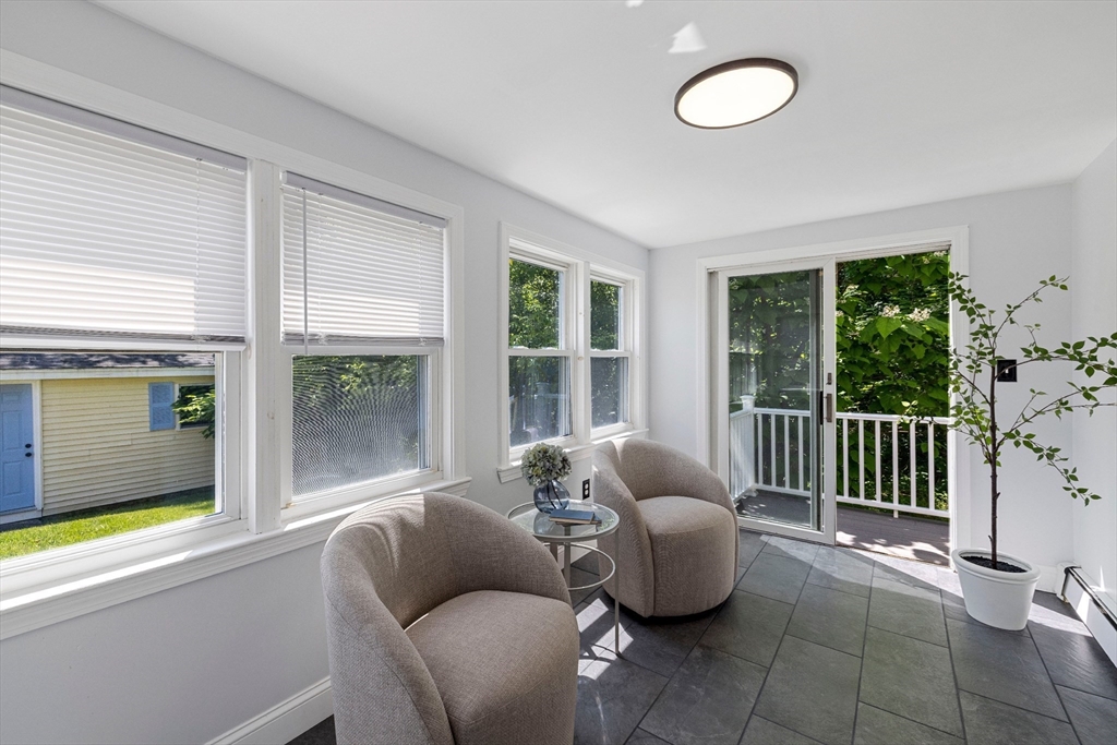 120 Columbia Road Lowell, MA 01854 - Photo 13 of 39 a living room with furniture and a floor to ceiling window
