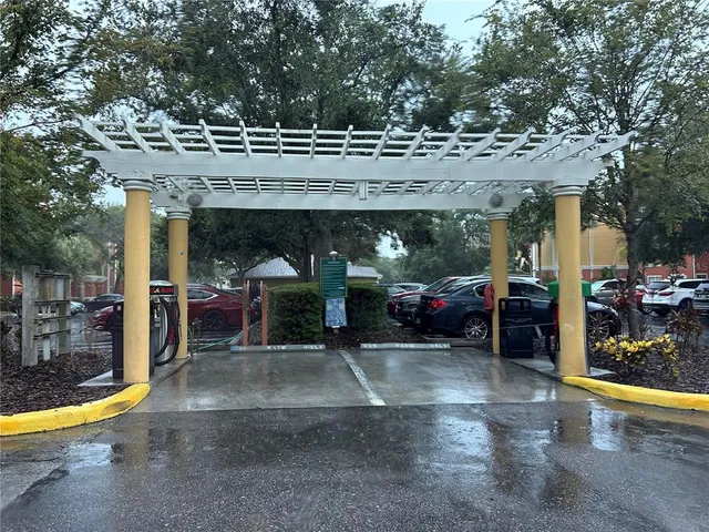 a view of an outdoor sitting area with a tree