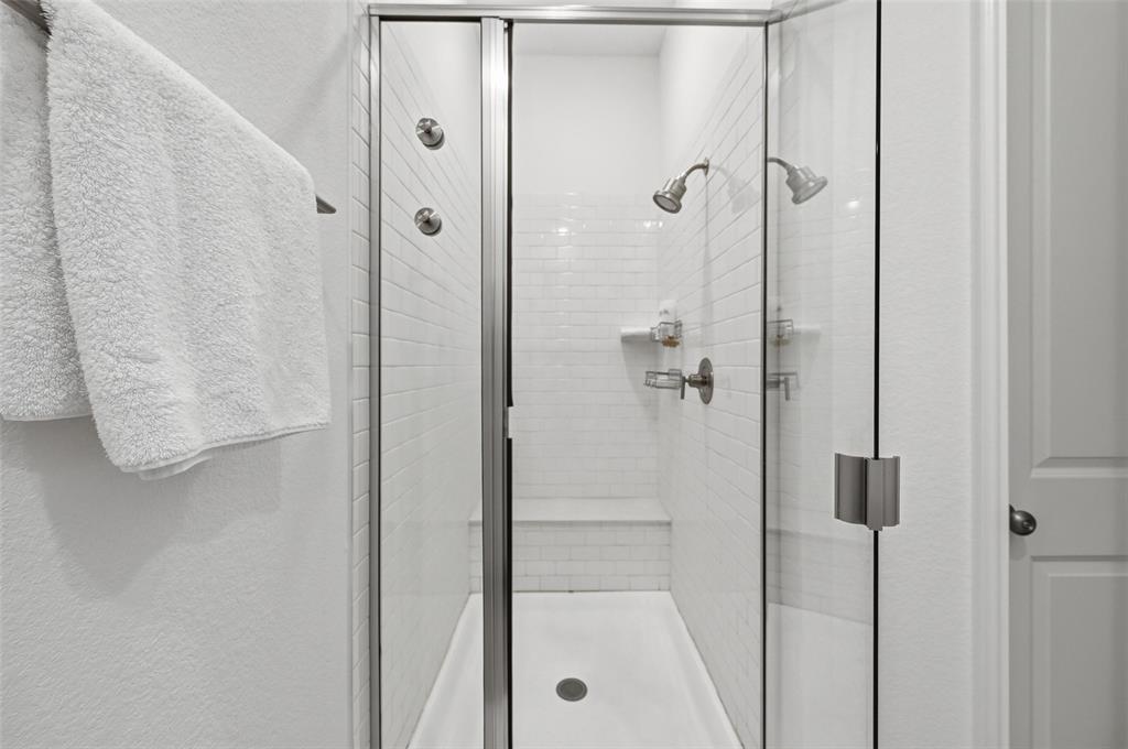 634 Blue Rdg Drive Mansfield, TX 76063 - Photo 12 of 25 a bathroom with a glass shower door