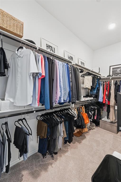 634 Blue Rdg Drive Mansfield, TX 76063 - Photo 13 of 25 a view of walk in closet with clothes and shoes