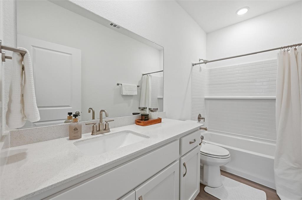 634 Blue Rdg Drive Mansfield, TX 76063 - Photo 16 of 25 a bathroom with a sink a toilet and shower
