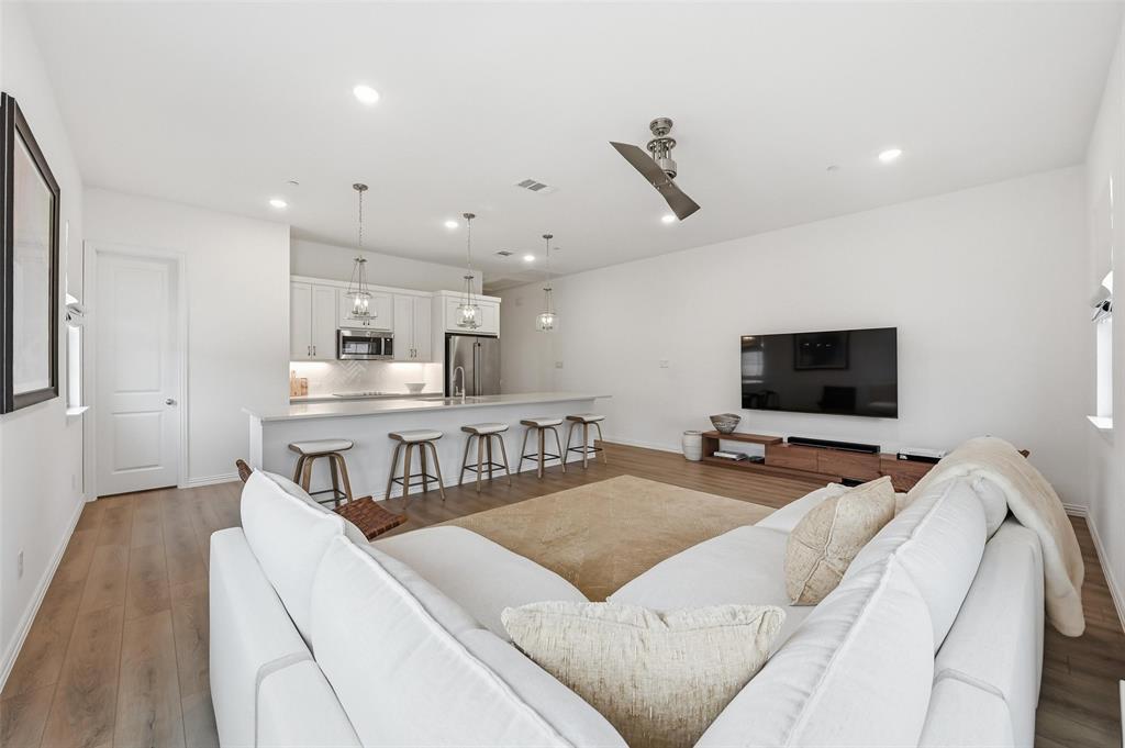 634 Blue Rdg Drive Mansfield, TX 76063 - Photo 4 of 25 a living room with furniture and a flat screen tv