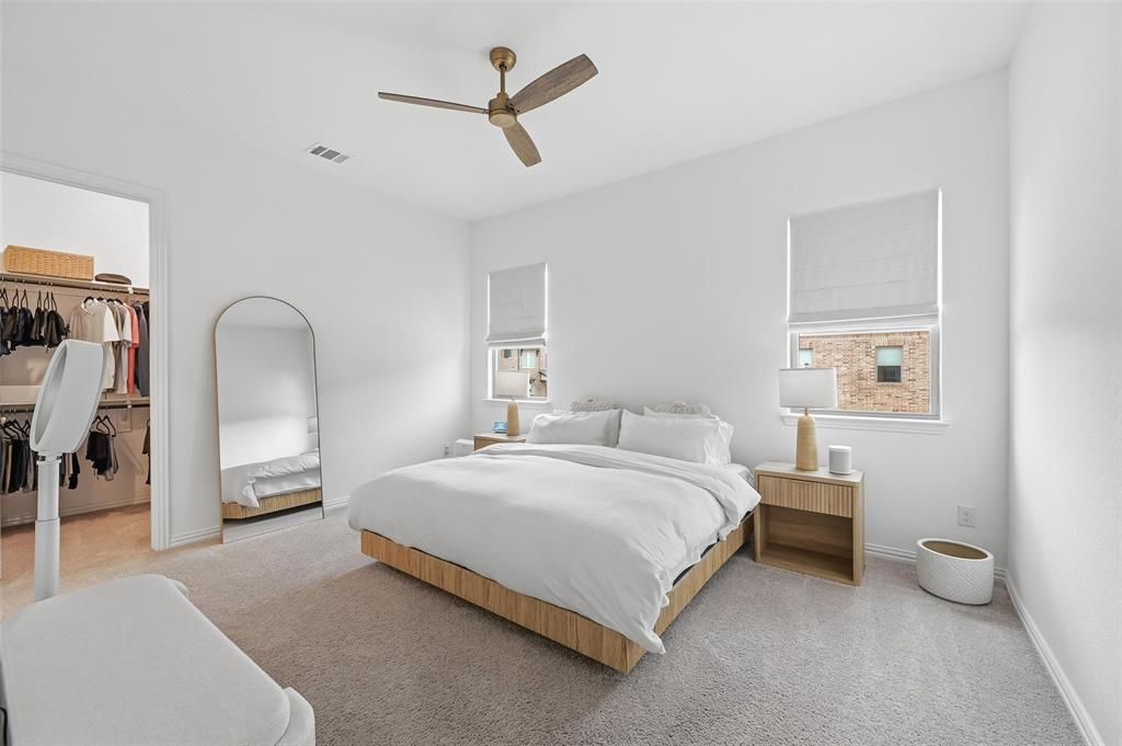 634 Blue Rdg Drive Mansfield, TX 76063 - Photo 10 of 25 a bedroom with a bed a lamp and a large window