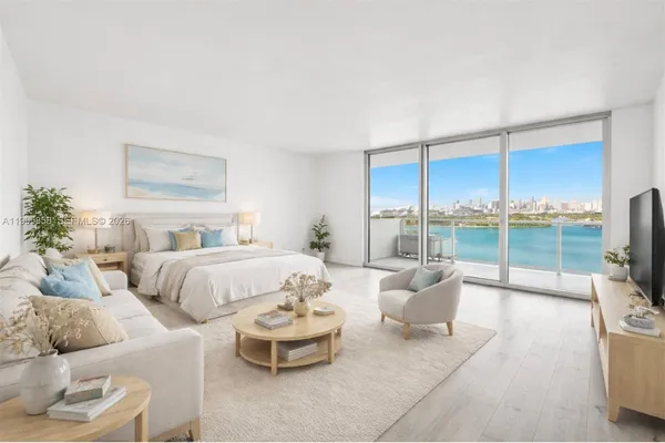 a spacious bedroom with a bed and large glass window