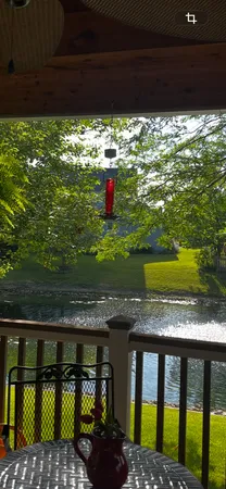 a view of a park with iron fence