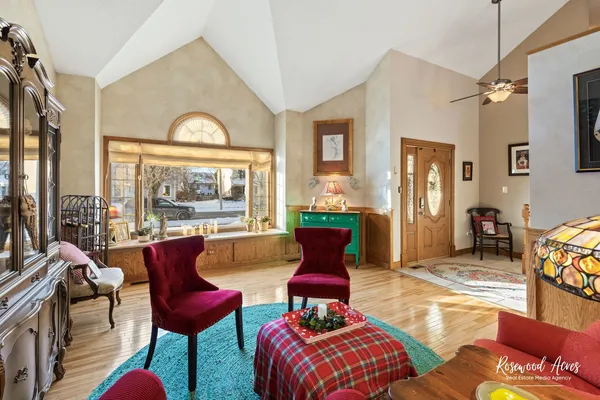 a living room with furniture and a large window