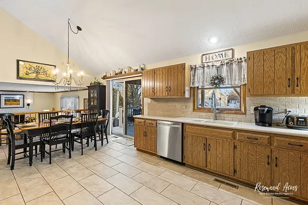 a kitchen with sink and cabinets