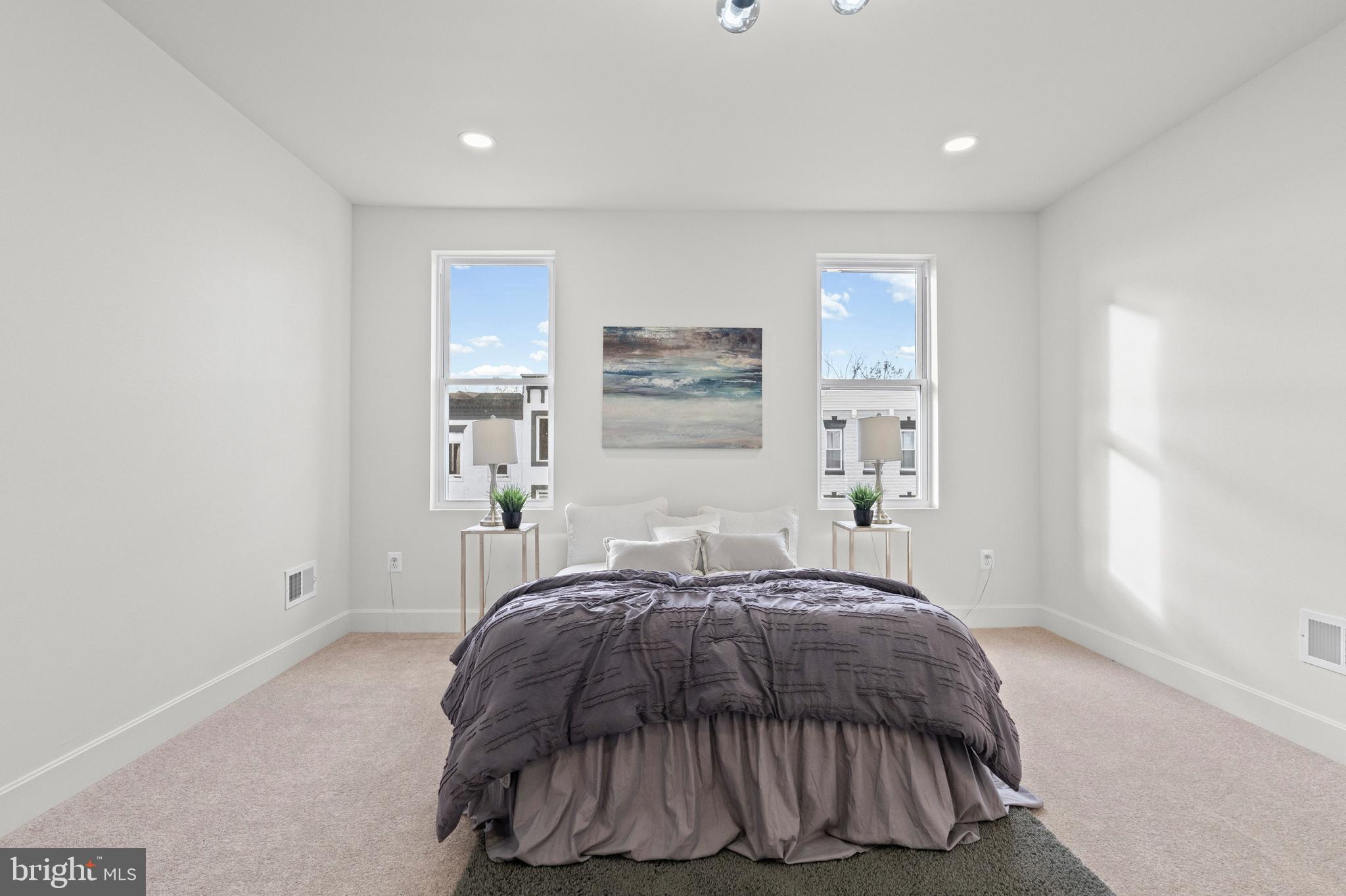 317 South Fulton Avenue Baltimore, MD 21223 - Photo 11 of 44 a bedroom with a bed and a window