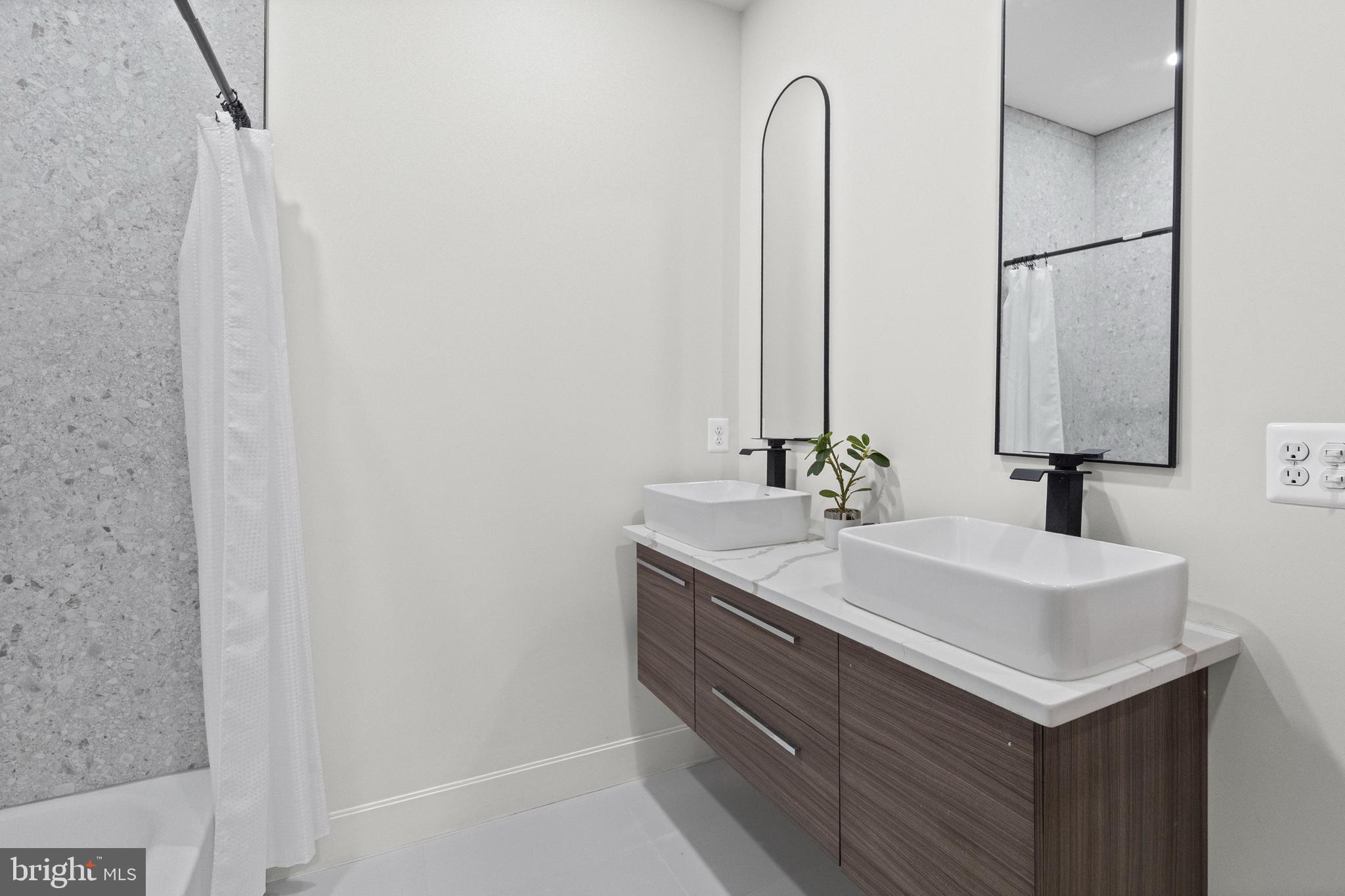 317 South Fulton Avenue Baltimore, MD 21223 - Photo 22 of 44 a bathroom with a sink and a mirror