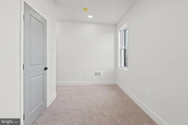 a bathroom with a double vanity sink toilet and shower