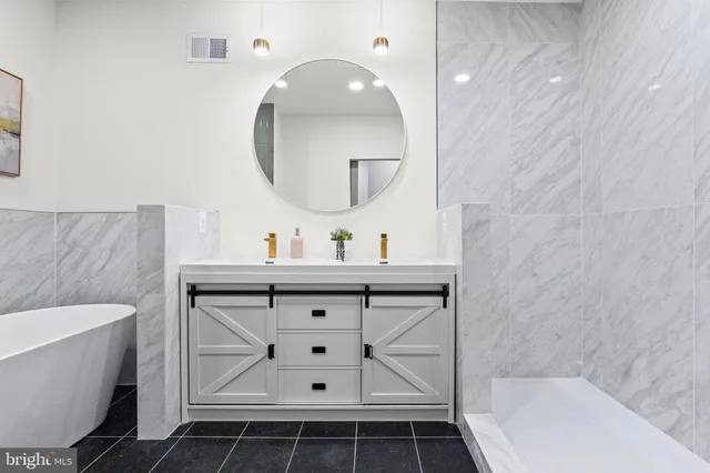 a city street lined with parked cars and buildings