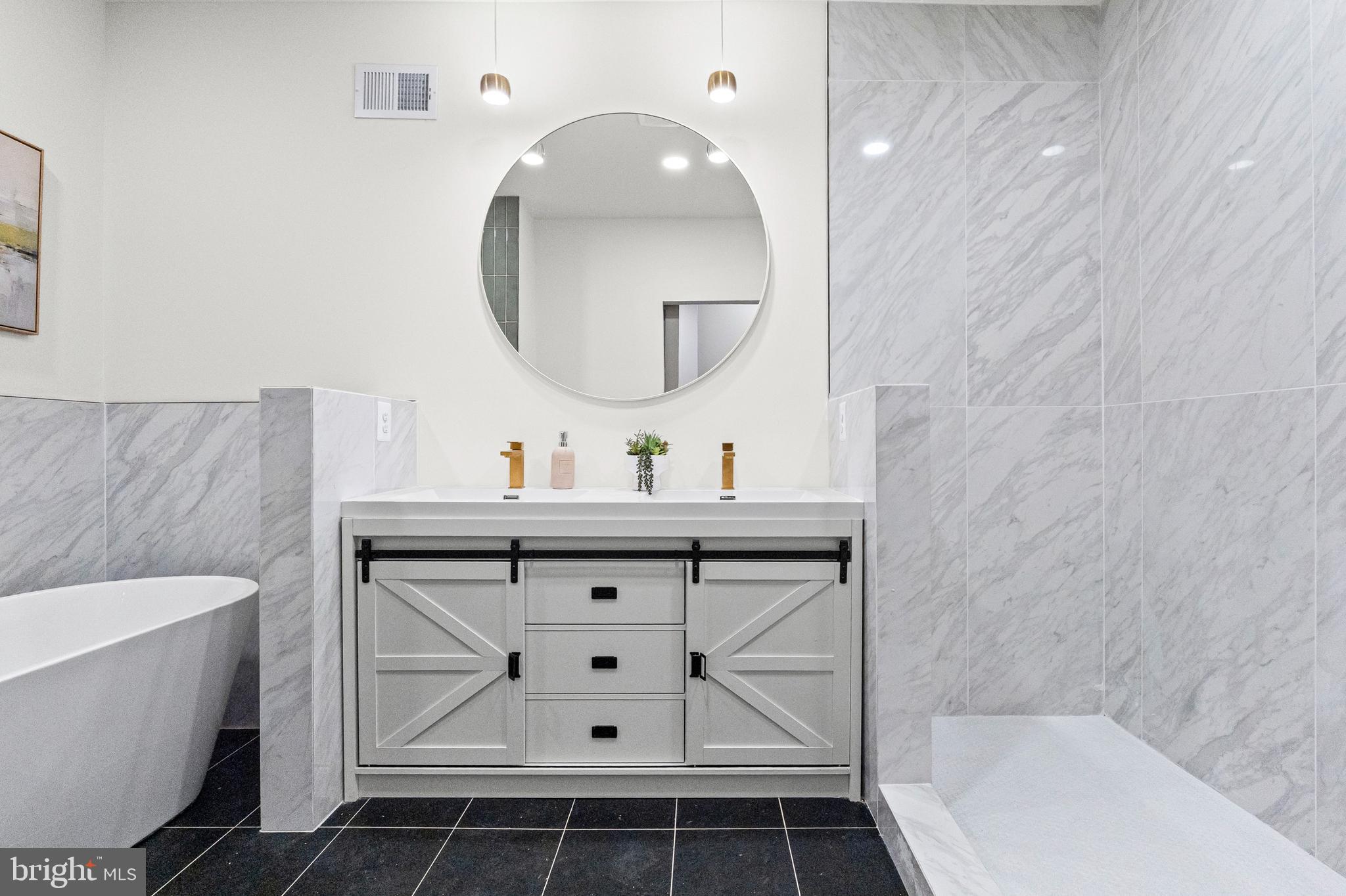 317 South Fulton Avenue Baltimore, MD 21223 - Photo 30 of 44 a bathroom with a sink and a mirror