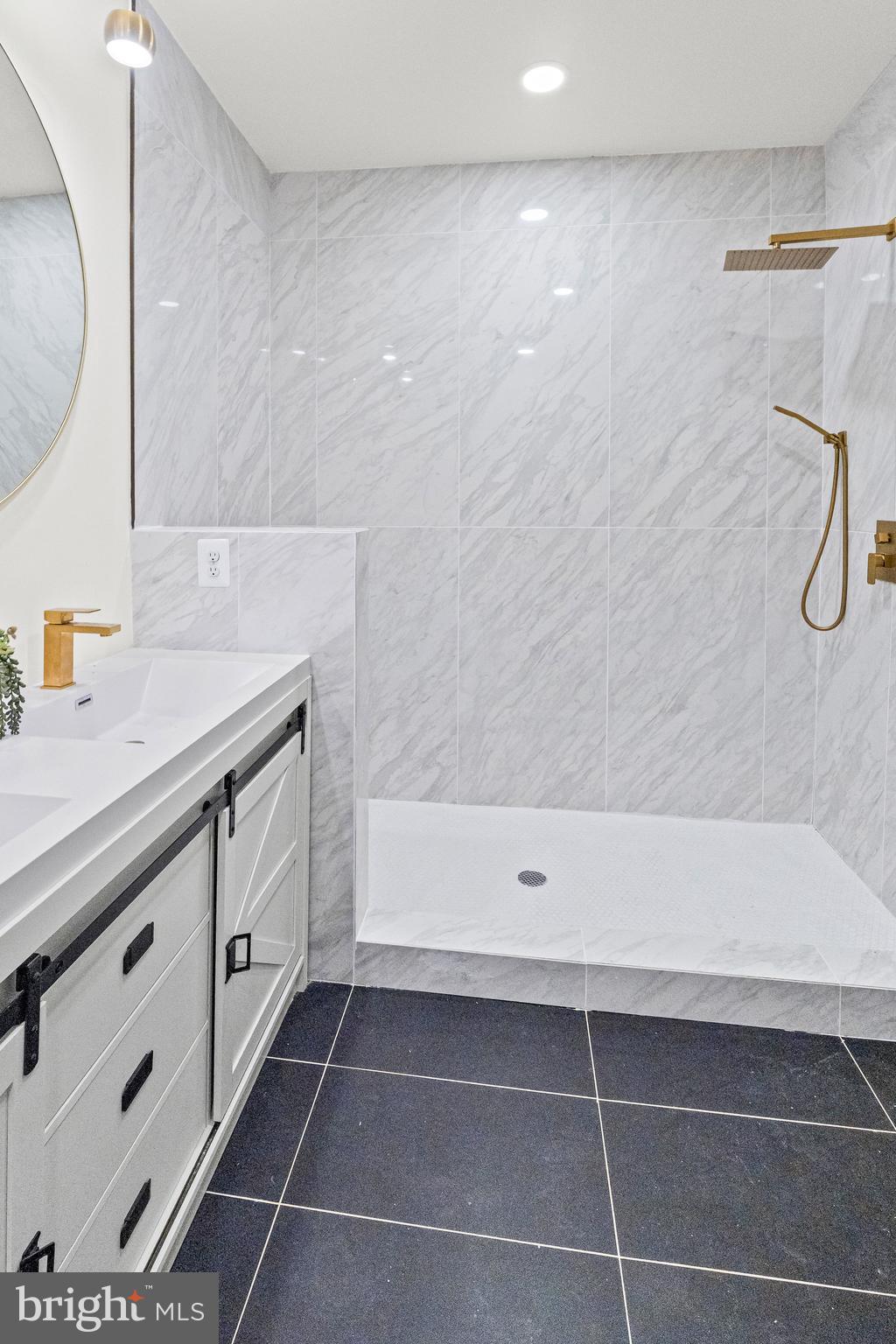 317 South Fulton Avenue Baltimore, MD 21223 - Photo 33 of 44 a bathroom with a bathtub and a sink