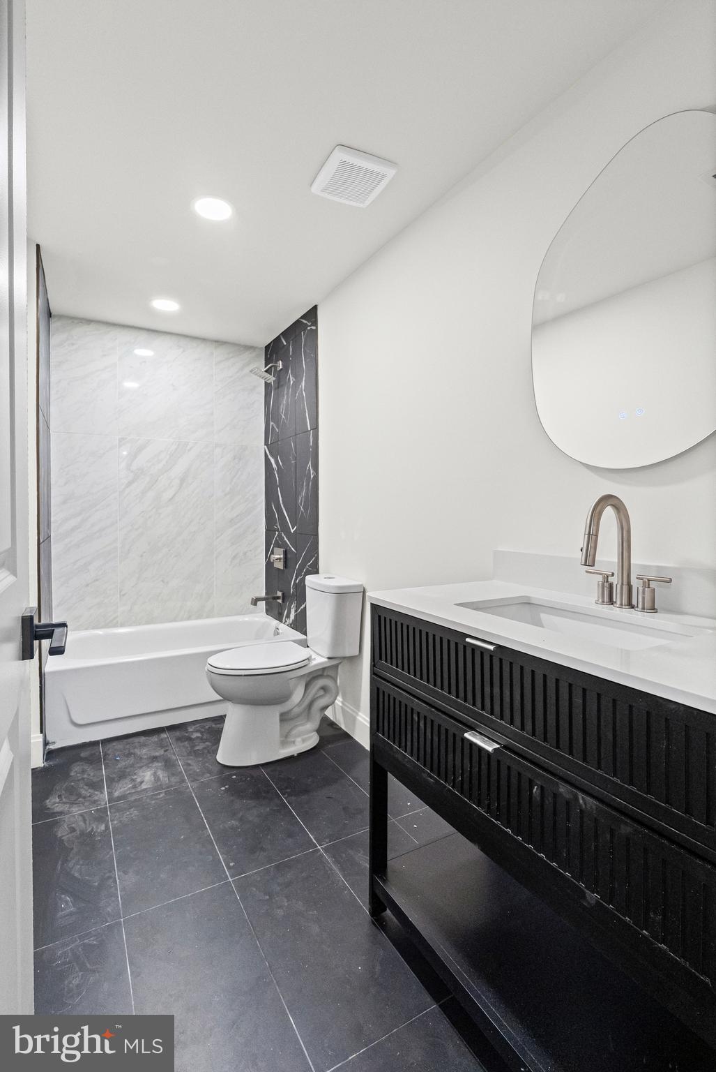 317 South Fulton Avenue Baltimore, MD 21223 - Photo 38 of 44 a bathroom with a sink a toilet and shower