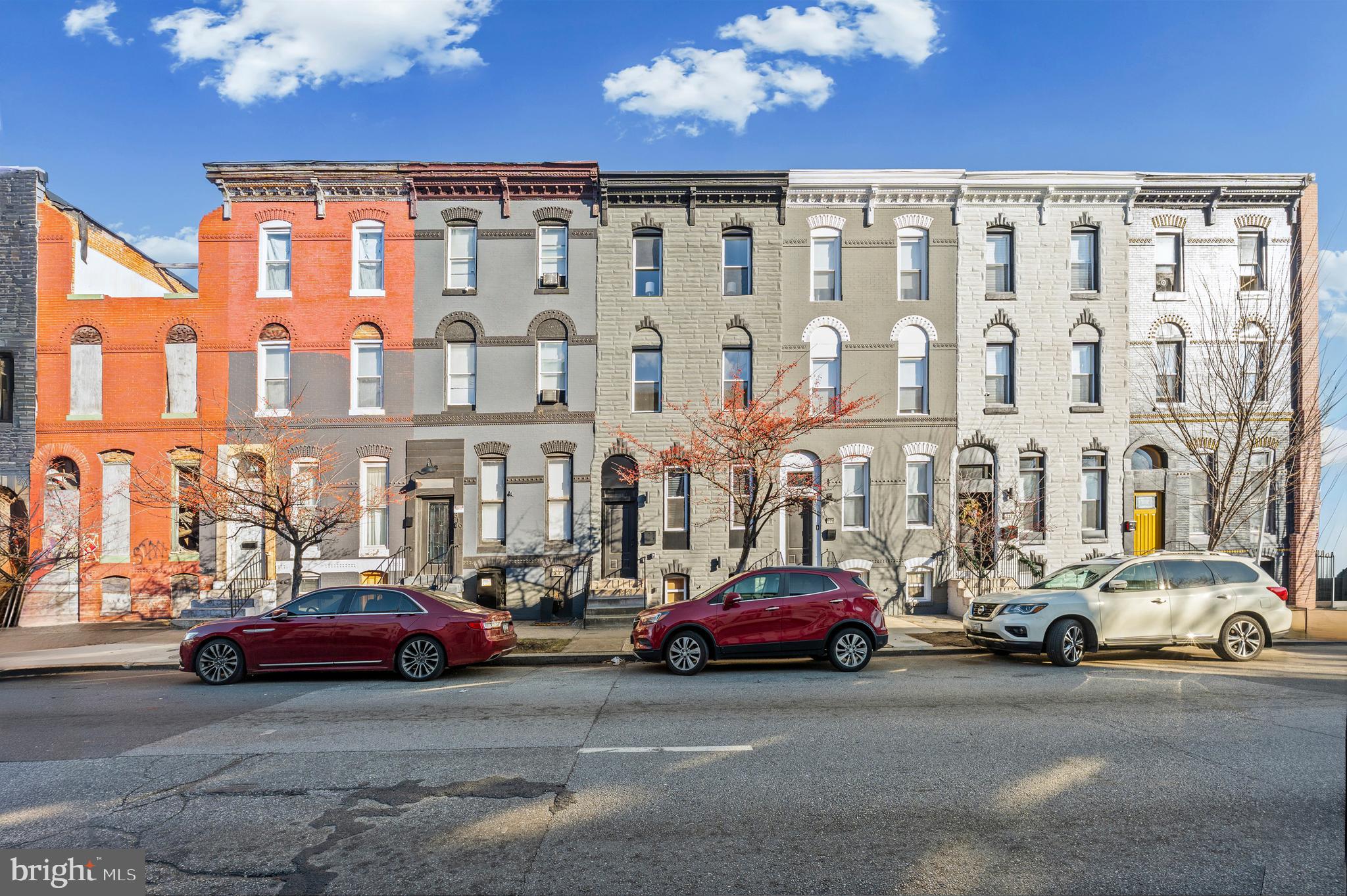 317 South Fulton Avenue Baltimore, MD 21223 - Photo 44 of 44 a city street lined with parked cars and buildings