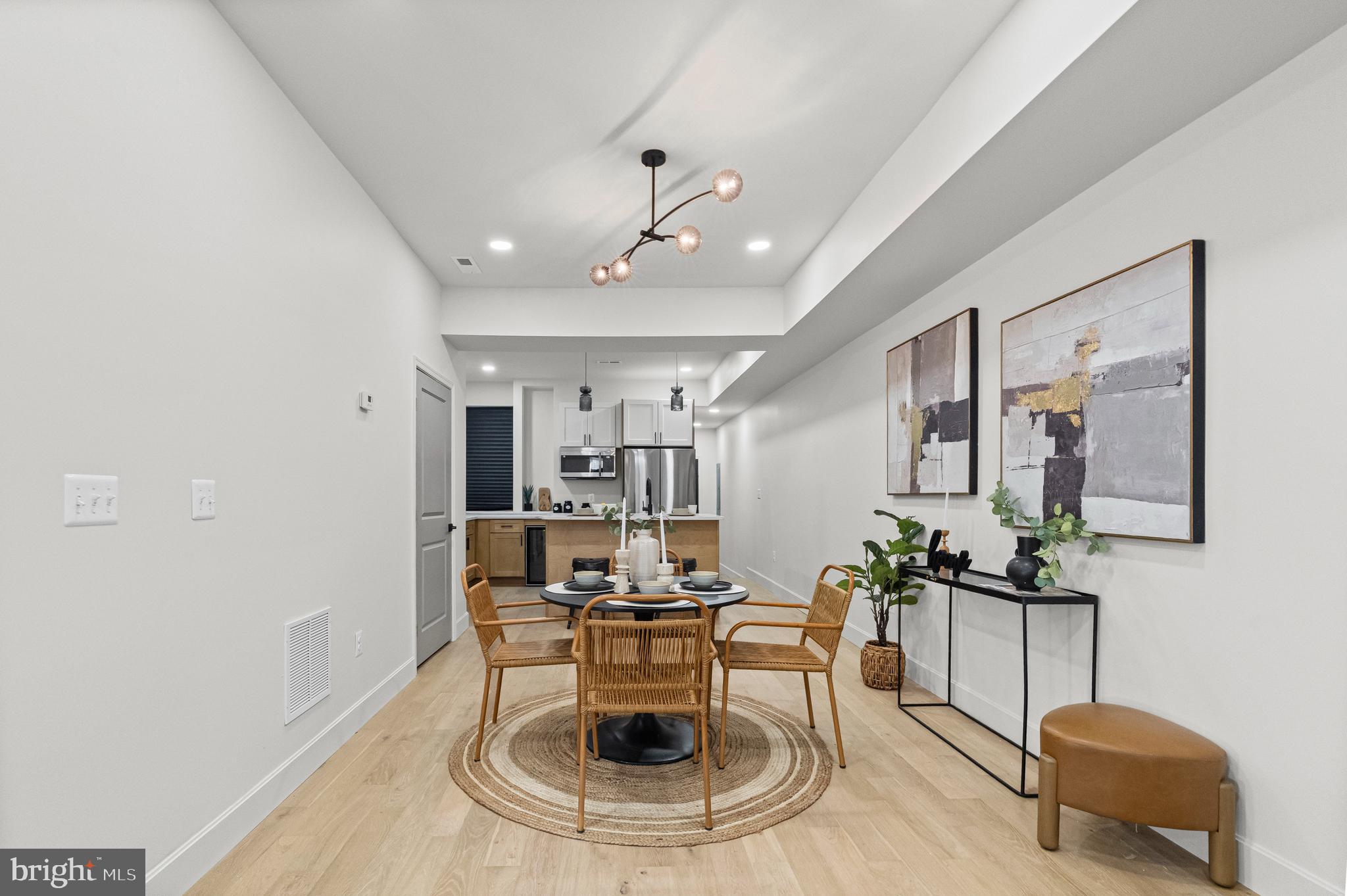 317 South Fulton Avenue Baltimore, MD 21223 - Photo 5 of 44 a living room with furniture and a table
