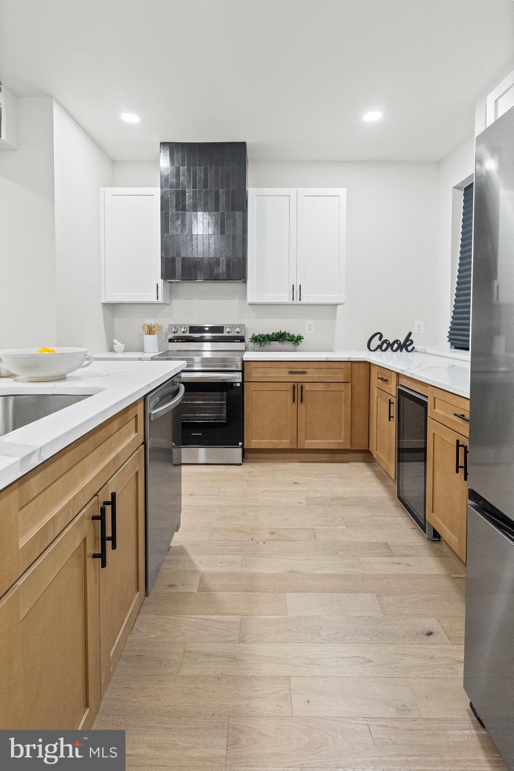 317 South Fulton Avenue Baltimore, MD 21223 - Photo 7 of 44 a large kitchen with stainless steel appliances granite countertop a stove a sink dishwasher and a refrigerator