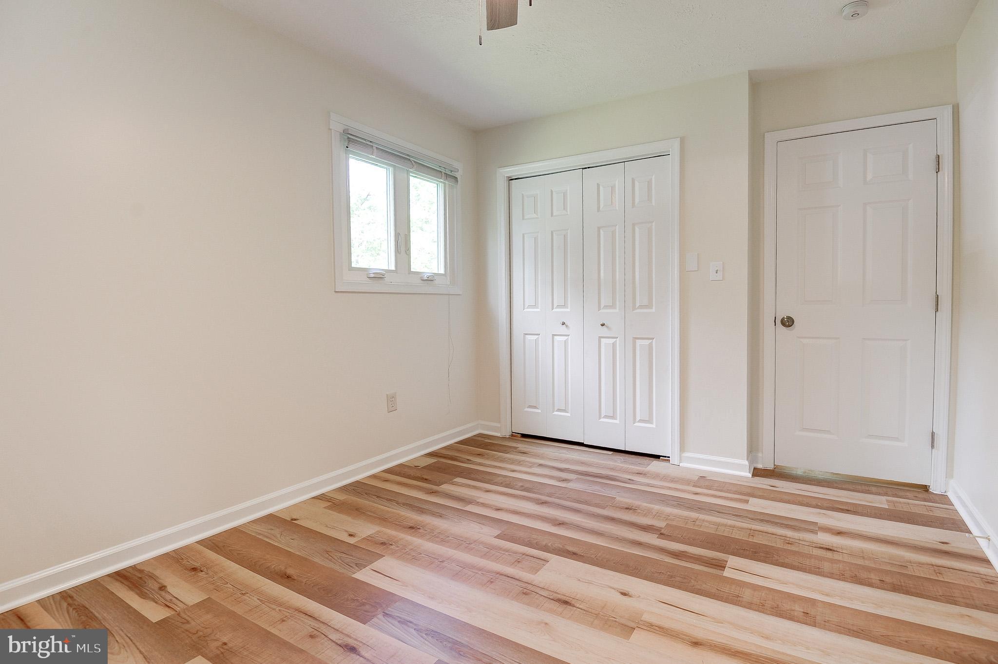 10116 Evans Ford Road Manassas, VA 20111 - Photo 37 of 63 a view of a livingroom with wooden floor and closet