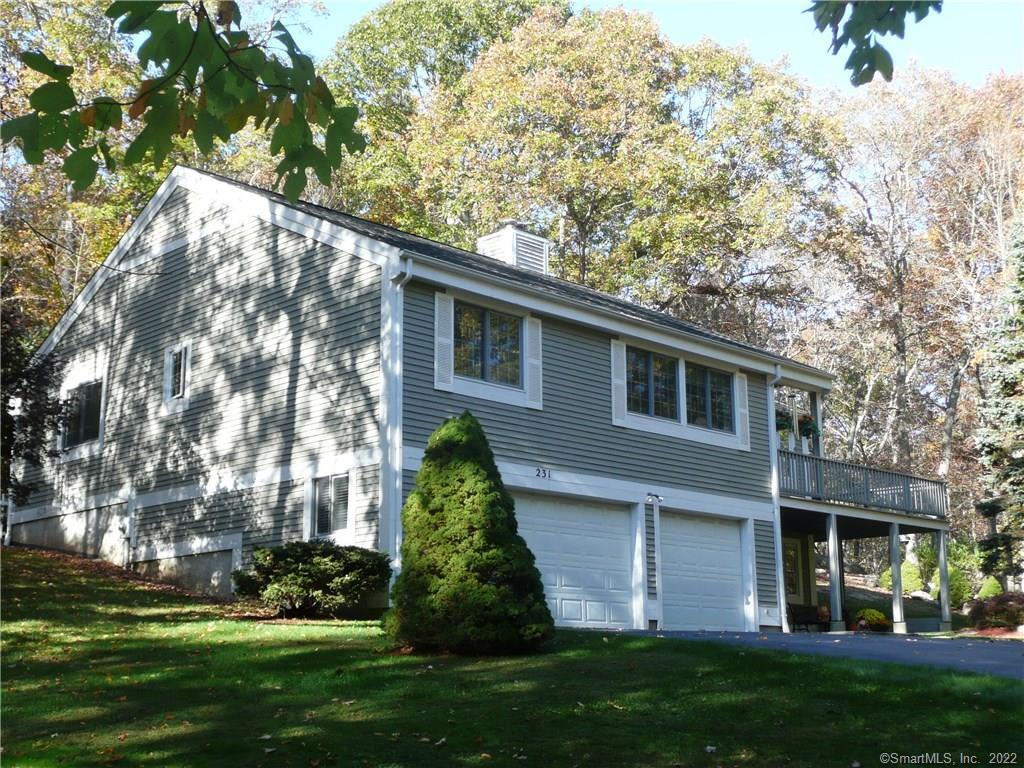 231 Chestnut Hill Road Killingworth, CT 06419 - Photo 1 of 1 a front view of a house with a garden