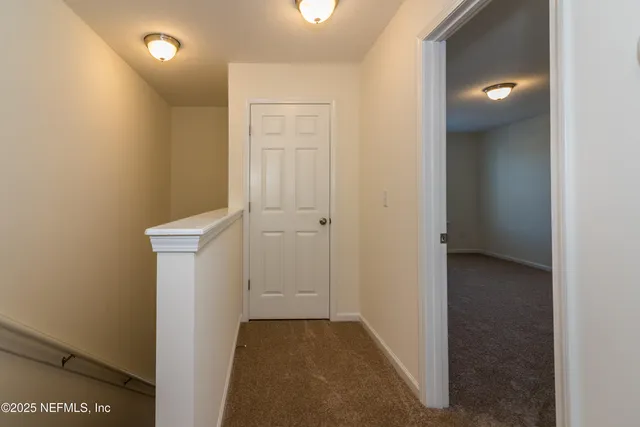 a view of a hallway with closet