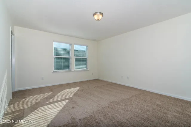 a bathroom with a sink a toilet a mirror and shower