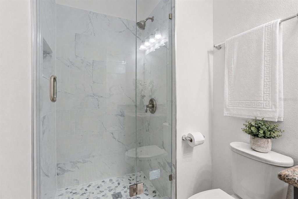 8531 Geddes Loop Orlando, FL 32836 - Photo 5 of 20 a bathroom with a shower a toilet and a shower