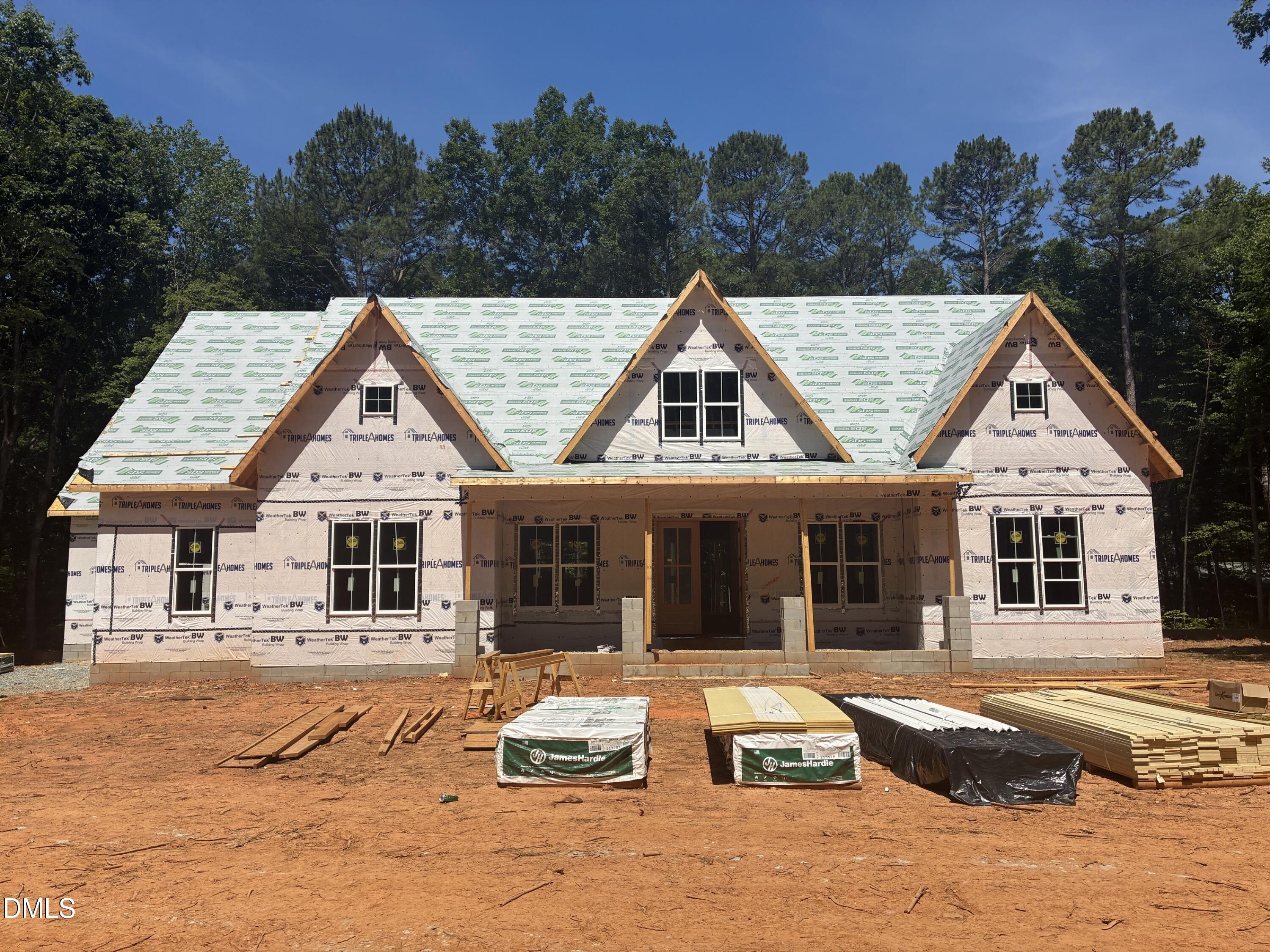 638 Old Goldston Road Pittsboro, NC 27312 - Photo 2 of 28 a view of a white house with a swimming pool and sitting area