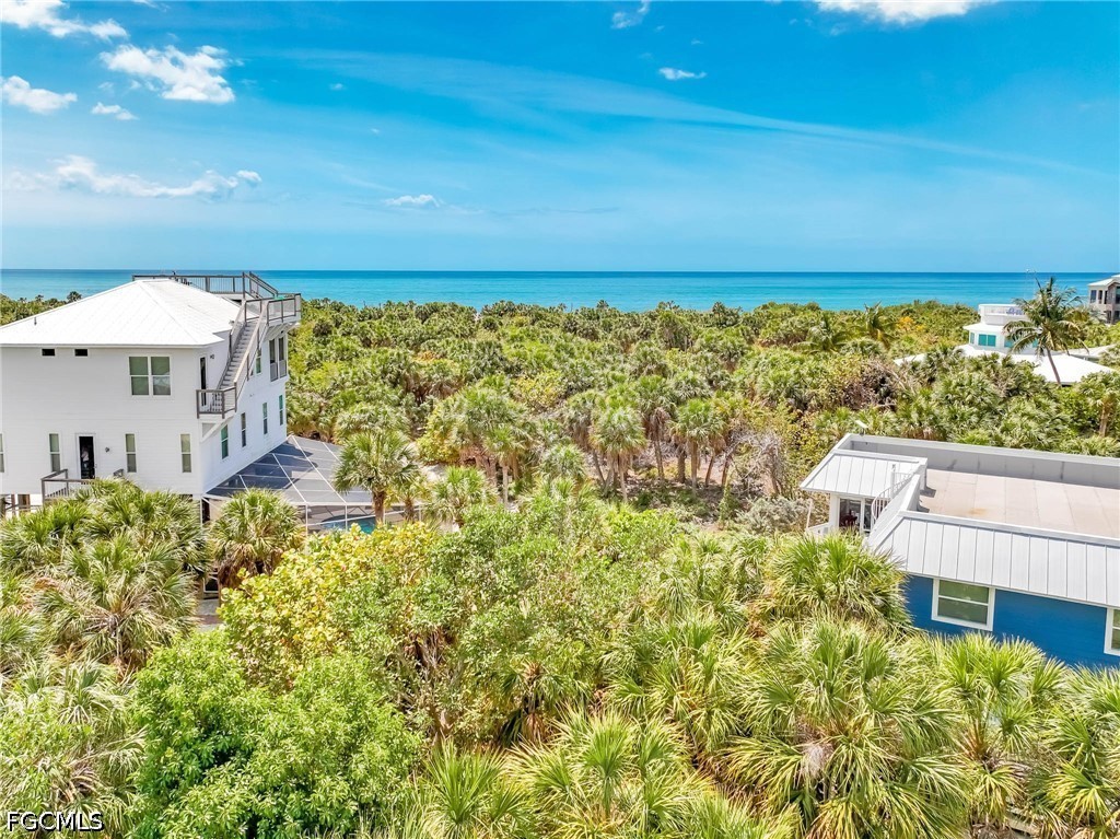 4491 Butterfly Shell Drive Upper Captiva, FL 33924 - Photo 14 of 27 a view of a house with a ocean view