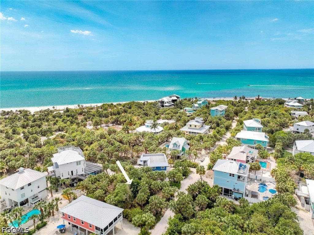 4491 Butterfly Shell Drive Upper Captiva, FL 33924 - Photo 17 of 27 an aerial view of ocean and residential houses with outdoor space