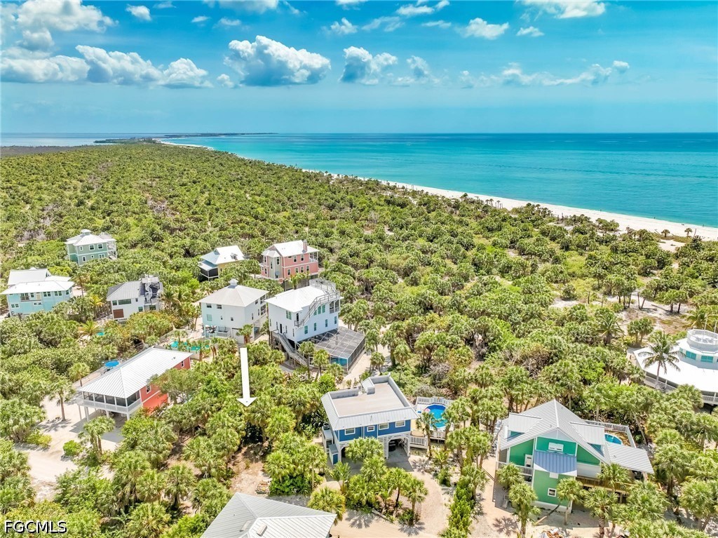 4491 Butterfly Shell Drive Upper Captiva, FL 33924 - Photo 3 of 27 a view of a city with an ocean