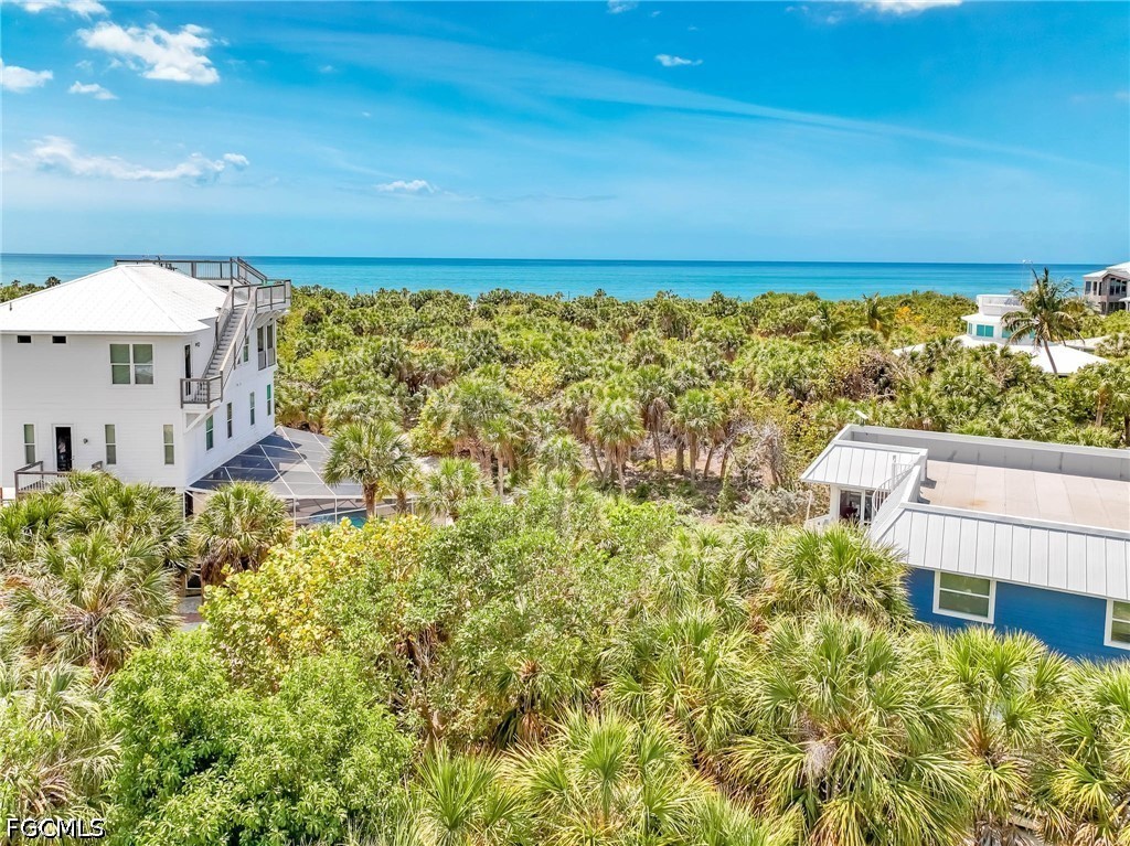 4491 Butterfly Shell Drive Upper Captiva, FL 33924 - Photo 8 of 27 a balcony with a yard and plants