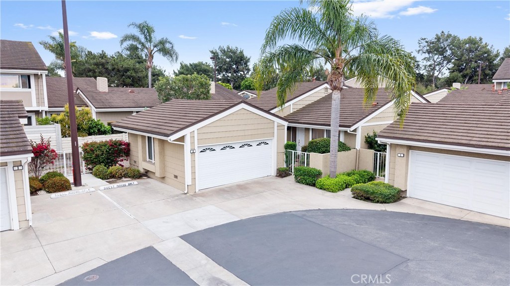 10 Coldstream, Unit 50 Irvine, CA 92604 - Photo 2 of 50 a view of a house with a yard and potted plants