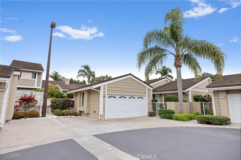 10 Coldstream, Unit 50 Irvine, CA 92604 - Photo 4 of 50 a front view of a house with a yard and garage