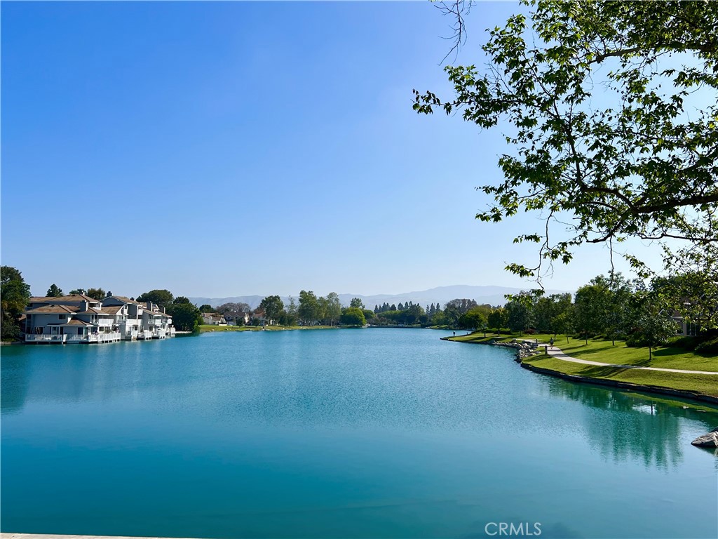 10 Coldstream, Unit 50 Irvine, CA 92604 - Photo 42 of 50 a view of a lake with houses in background