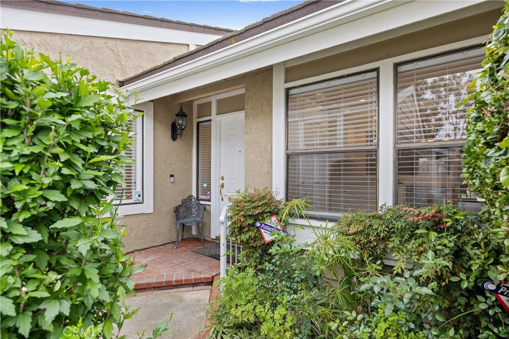 10 Coldstream, Unit 50 Irvine, CA 92604 - Photo 6 of 50 a potted plant in front of a house
