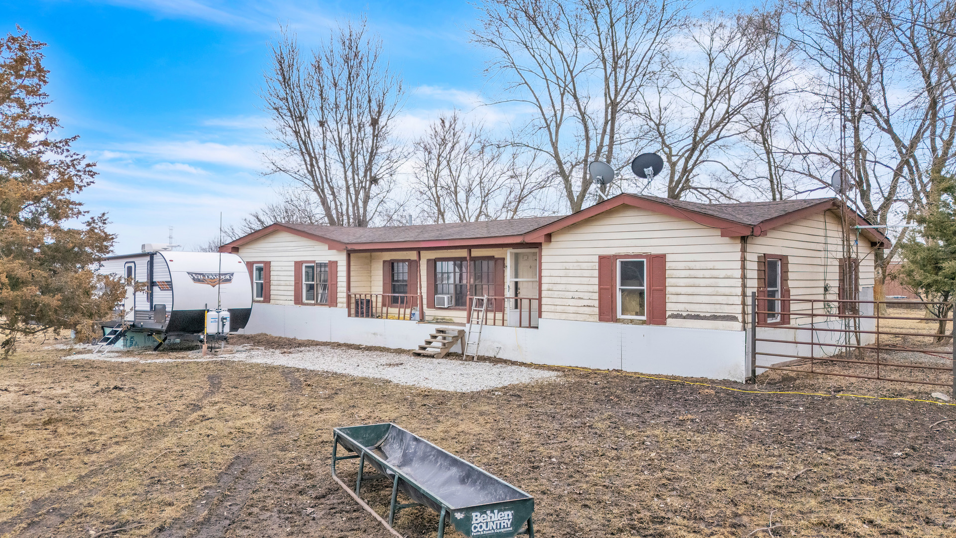 13745 West Bruns Road Manhattan, IL 60442 - Photo 38 of 55 a front view of a house with yard and trees in the background