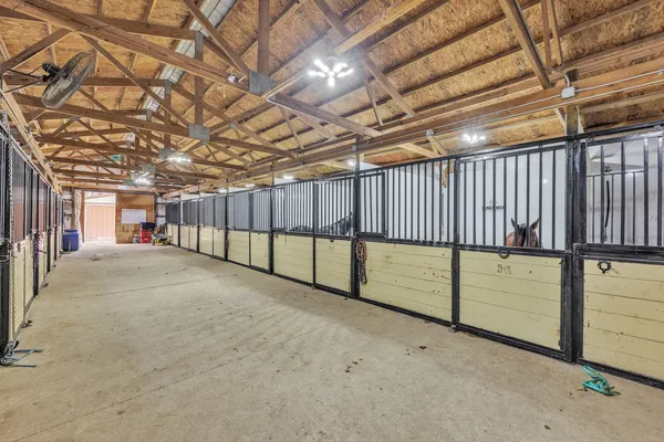 a view of empty room with wooden walls