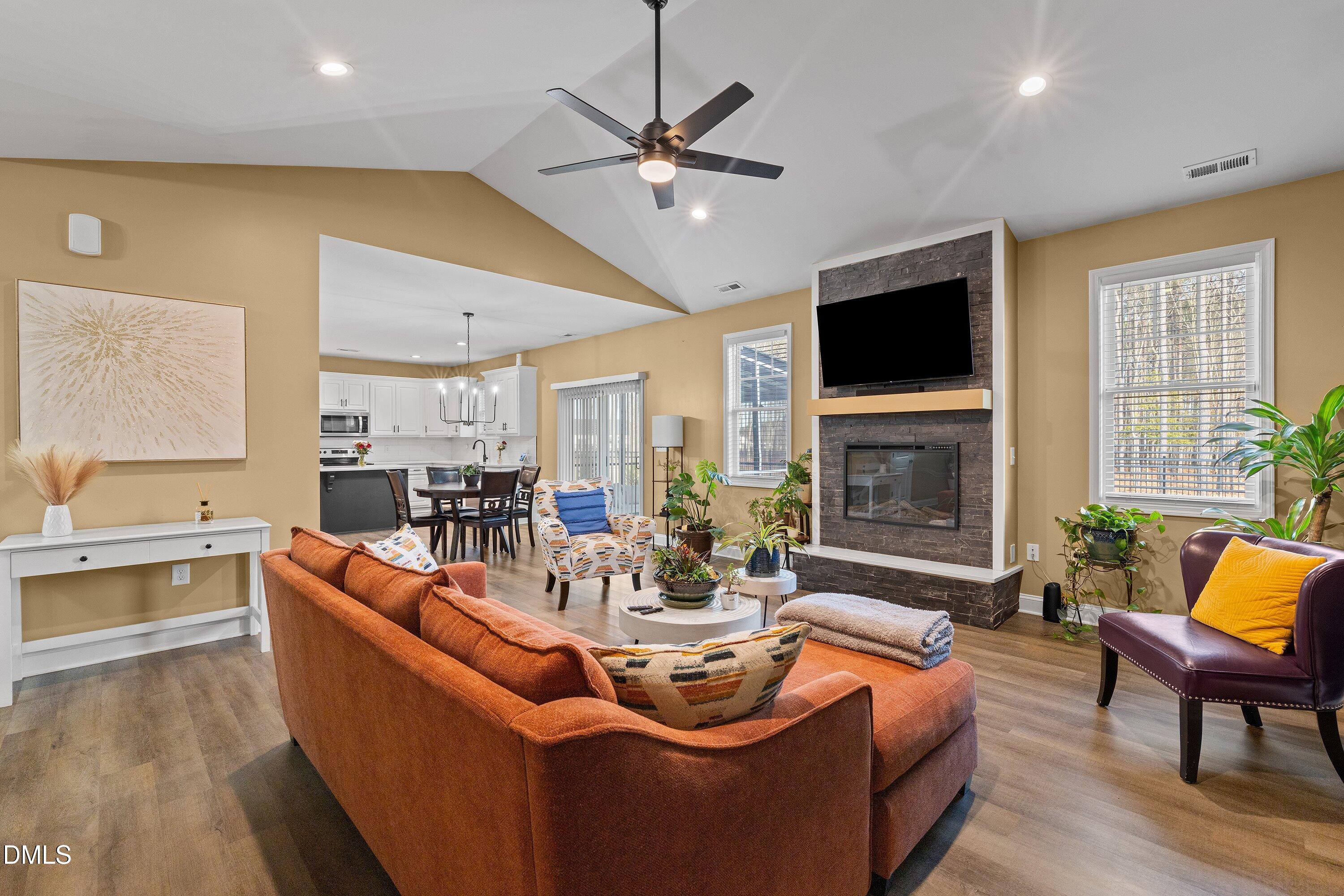 9159 Byron Court Bailey, NC 27807 - Photo 5 of 16 a living room with fireplace furniture and a flat screen tv