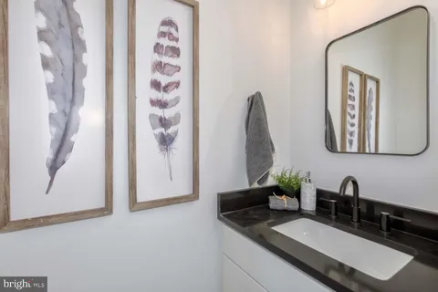 a living room with furniture and large windows