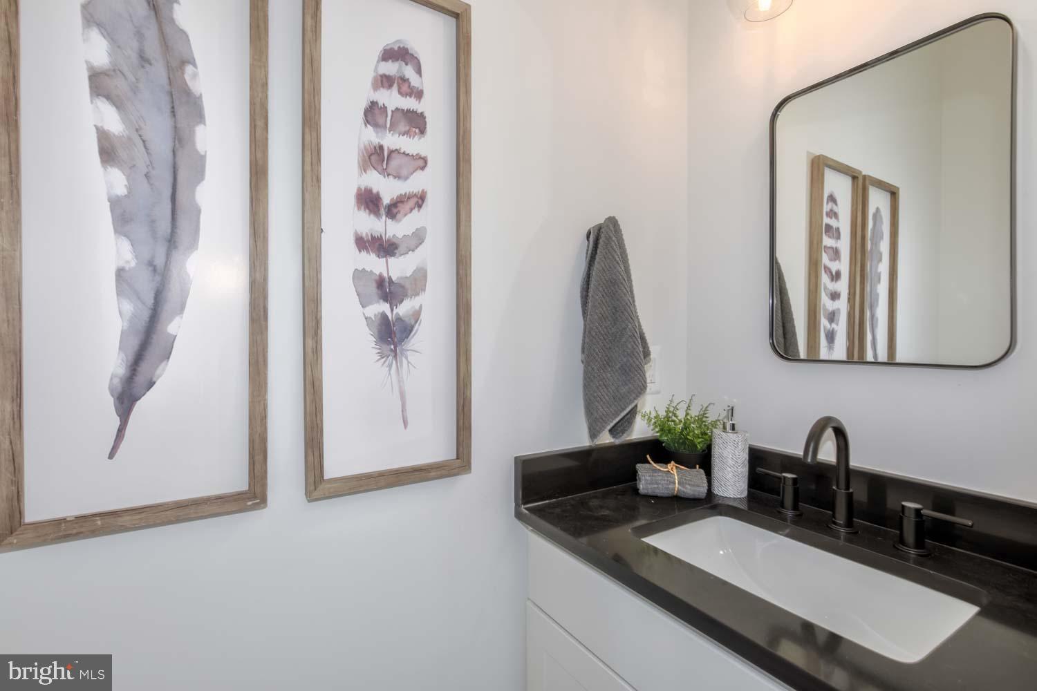426 Manor Place Northwest, Unit C Washington, DC 20010 - Photo 10 of 27 a bathroom with a double vanity sink and a mirror