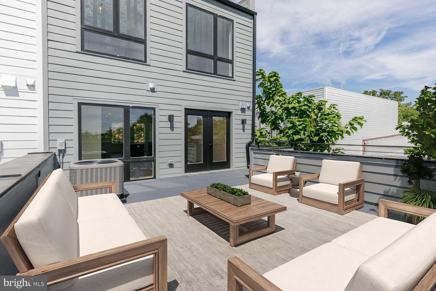 426 Manor Place Northwest, Unit C Washington, DC 20010 - Photo 19 of 27 a view of a patio with couches table and chairs and potted plants