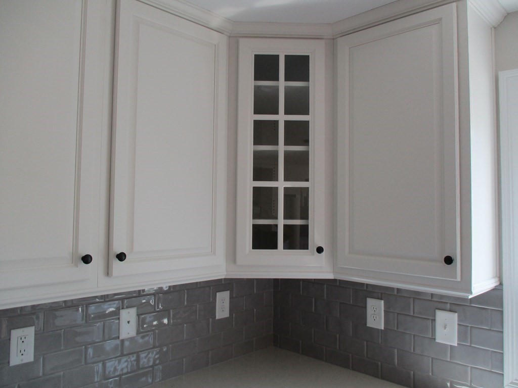 247 High Street Billerica, MA 01862 - Photo 11 of 26 a view of an empty room with a cabinet